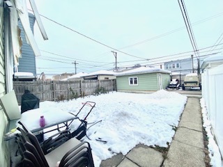 5225 West Deming Place, Unit 2 Chicago, IL 60639 - Photo 27 of 29 a car parked on the side of road