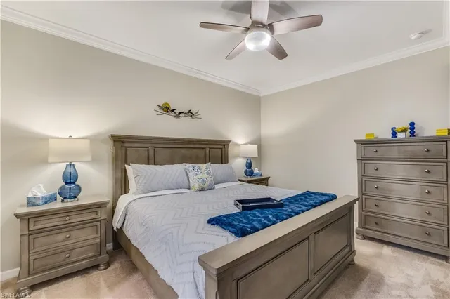 a bed room with a bed and a chandelier