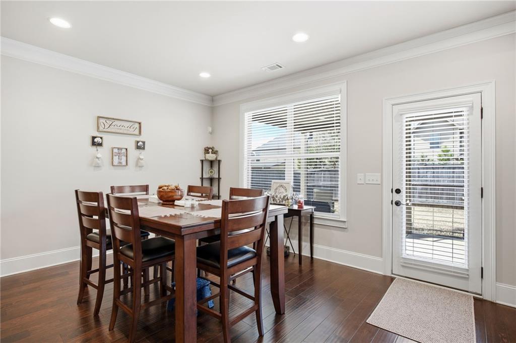 79 Gray Trail Acworth, GA 30101 - Photo 16 of 40 a view of a dining room with furniture and wooden floor