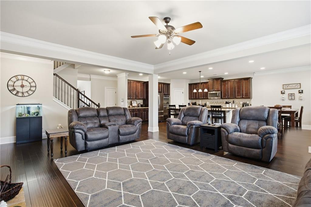 79 Gray Trail Acworth, GA 30101 - Photo 21 of 40 a living room with furniture kitchen view and a chandelier
