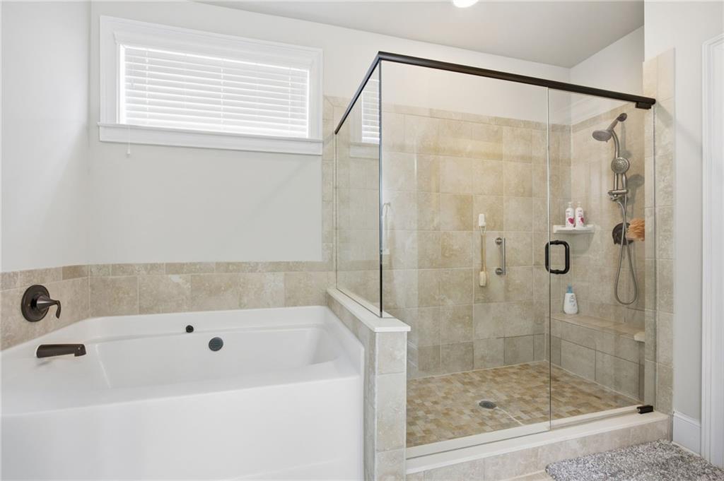 79 Gray Trail Acworth, GA 30101 - Photo 26 of 40 a bathroom with a bathtub and a shower