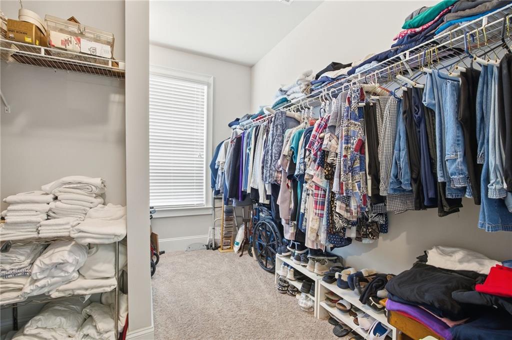 79 Gray Trail Acworth, GA 30101 - Photo 27 of 40 a view of walk in closet with clothes