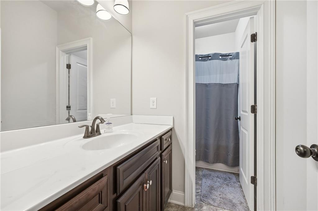 79 Gray Trail Acworth, GA 30101 - Photo 34 of 40 a bathroom with a sink and a mirror