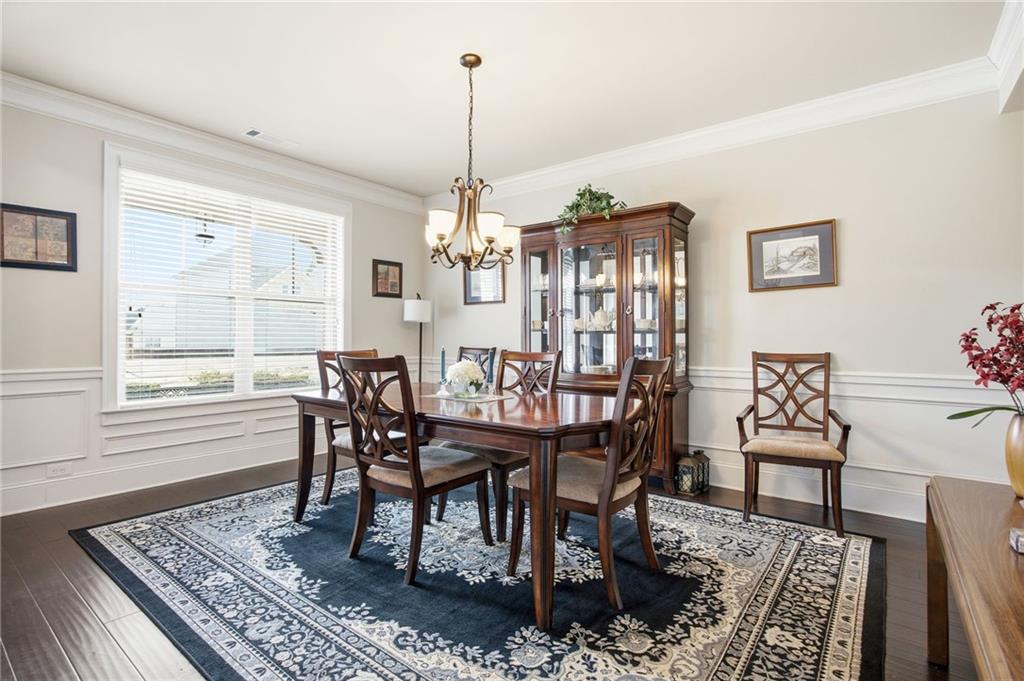 79 Gray Trail Acworth, GA 30101 - Photo 8 of 40 a dining room with furniture a rug and a rug