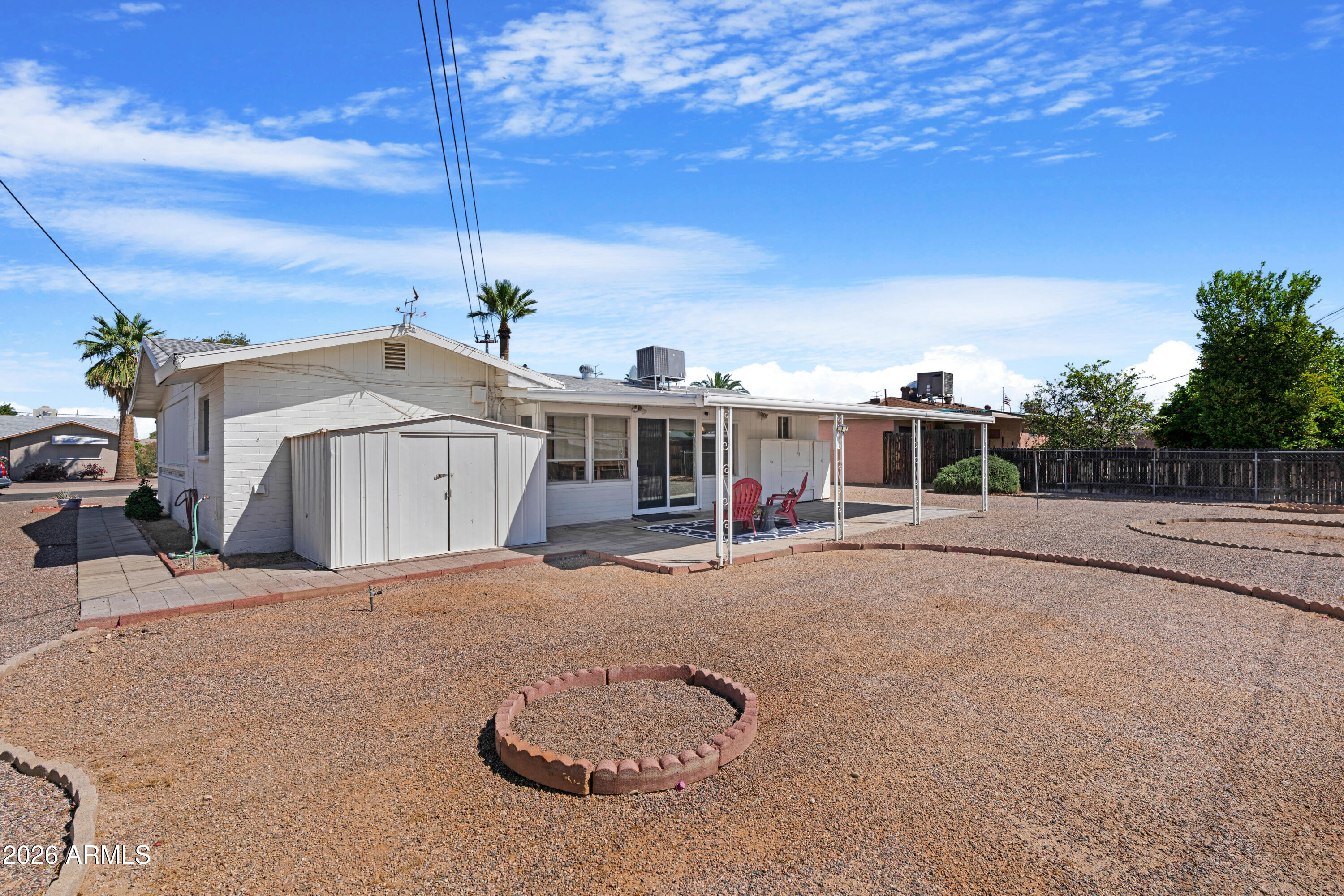 5437 East Butte Street Mesa, AZ 85205 - Photo 38 of 56 a view of a house with backyard and a play ground