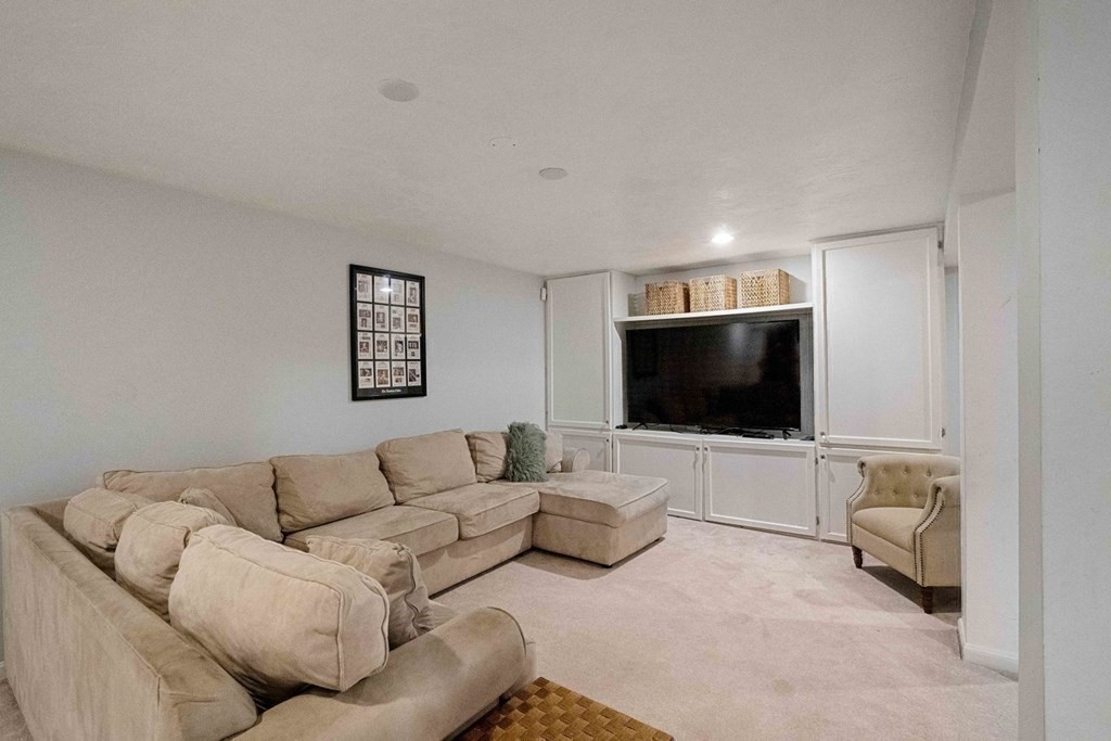 850 Boston Post Road Weston, MA 02493 - Photo 19 of 29 a living room with furniture and a flat screen tv