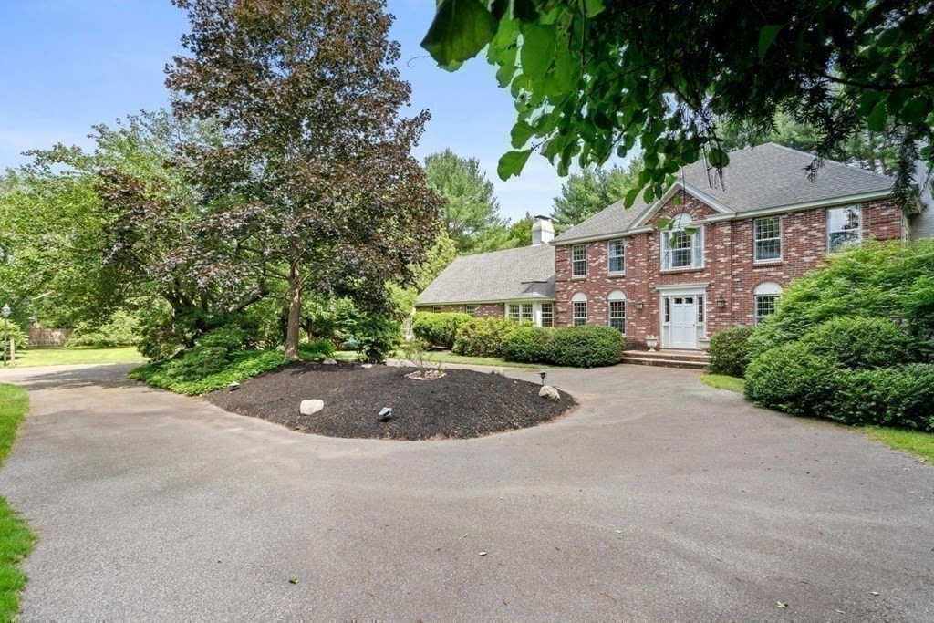 850 Boston Post Road Weston, MA 02493 - Photo 27 of 29 a front view of a house with a yard and garage