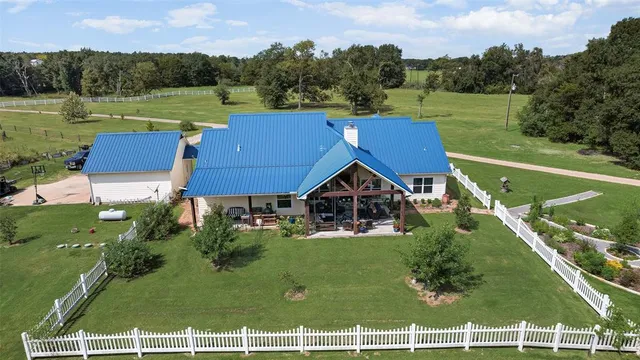 an aerial view of a house with a garden