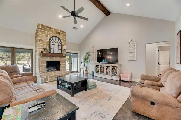 a kitchen with a sink and chairs
