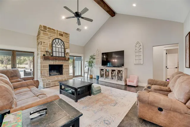a kitchen with a sink and chairs