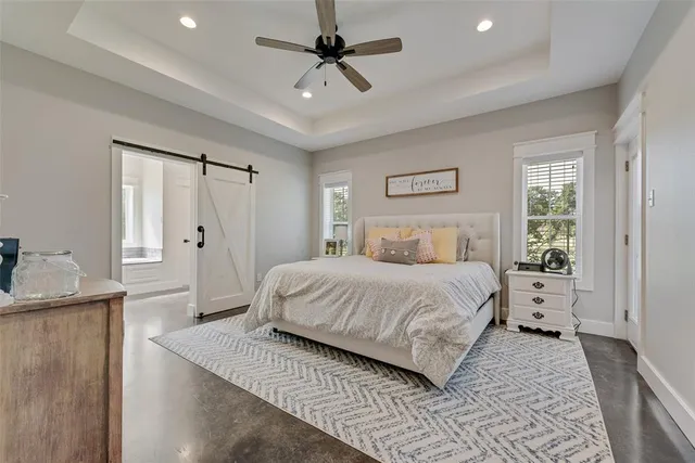 a large bathroom with double vanity and a mirror