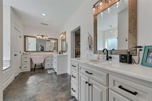 a bathroom with a sink and mirror