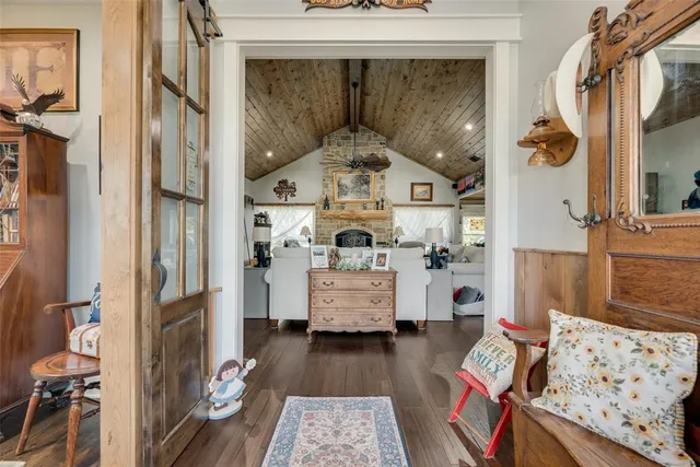 a view of living room with furniture and a fireplace