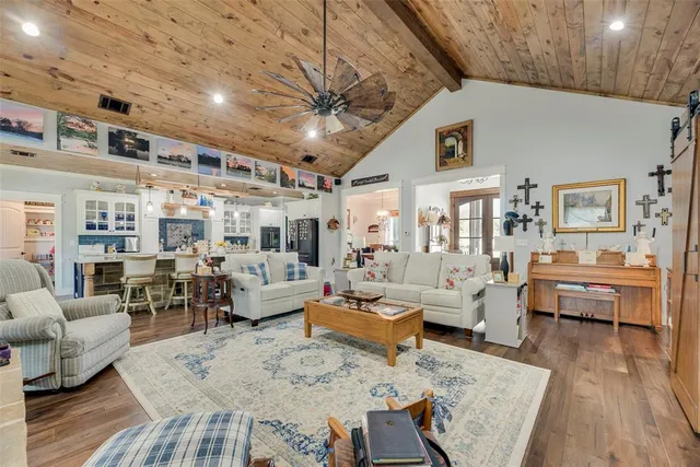 a living room with furniture wooden floor and wooden floor