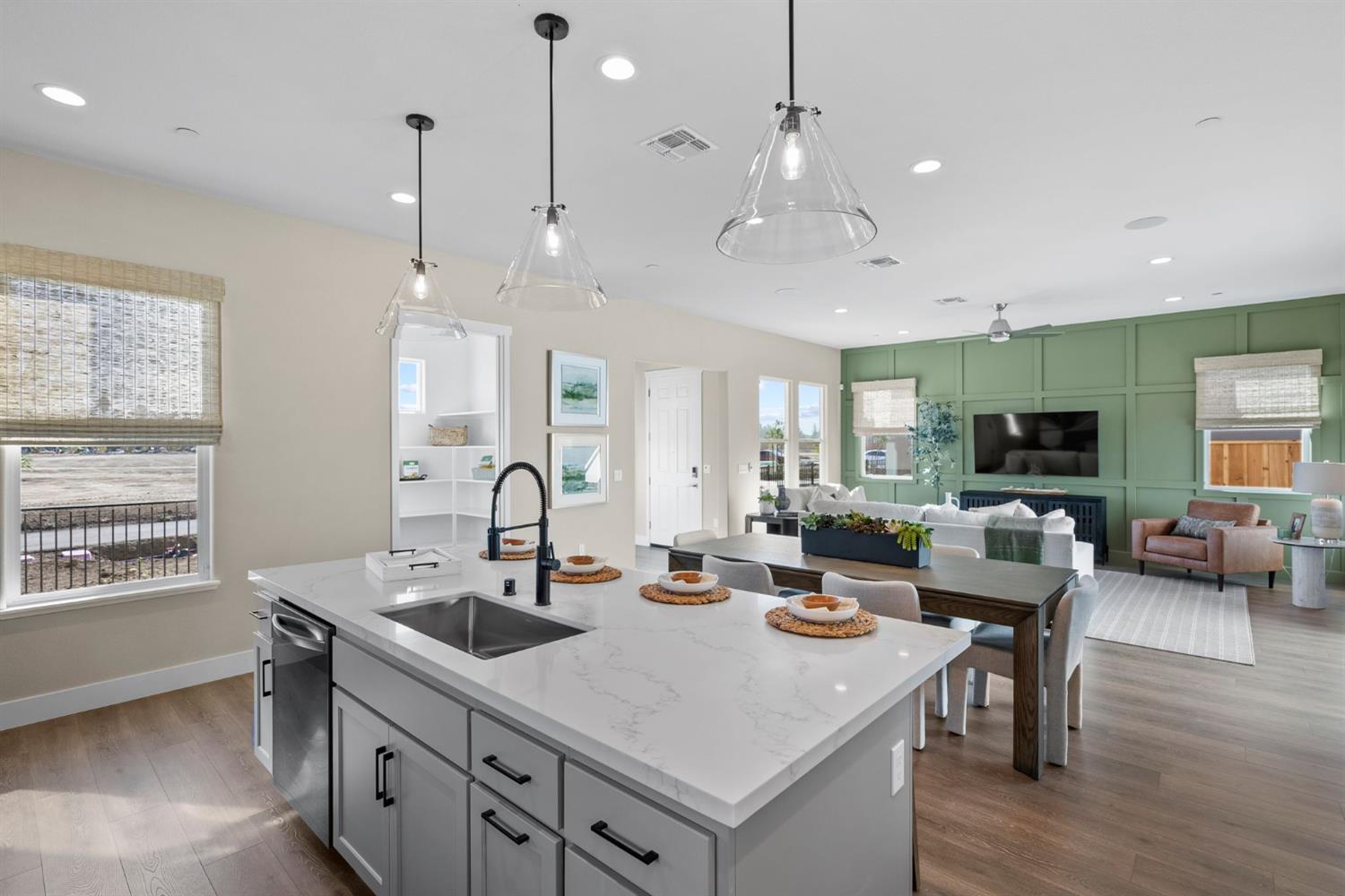 1815 Foster Lane Davis, CA 95616 - Photo 15 of 44 a kitchen with a stove a kitchen island a sink and living room view