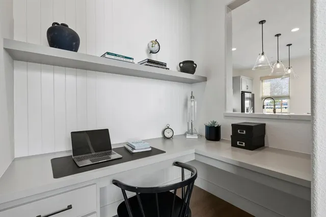 a view of a workspace with furniture