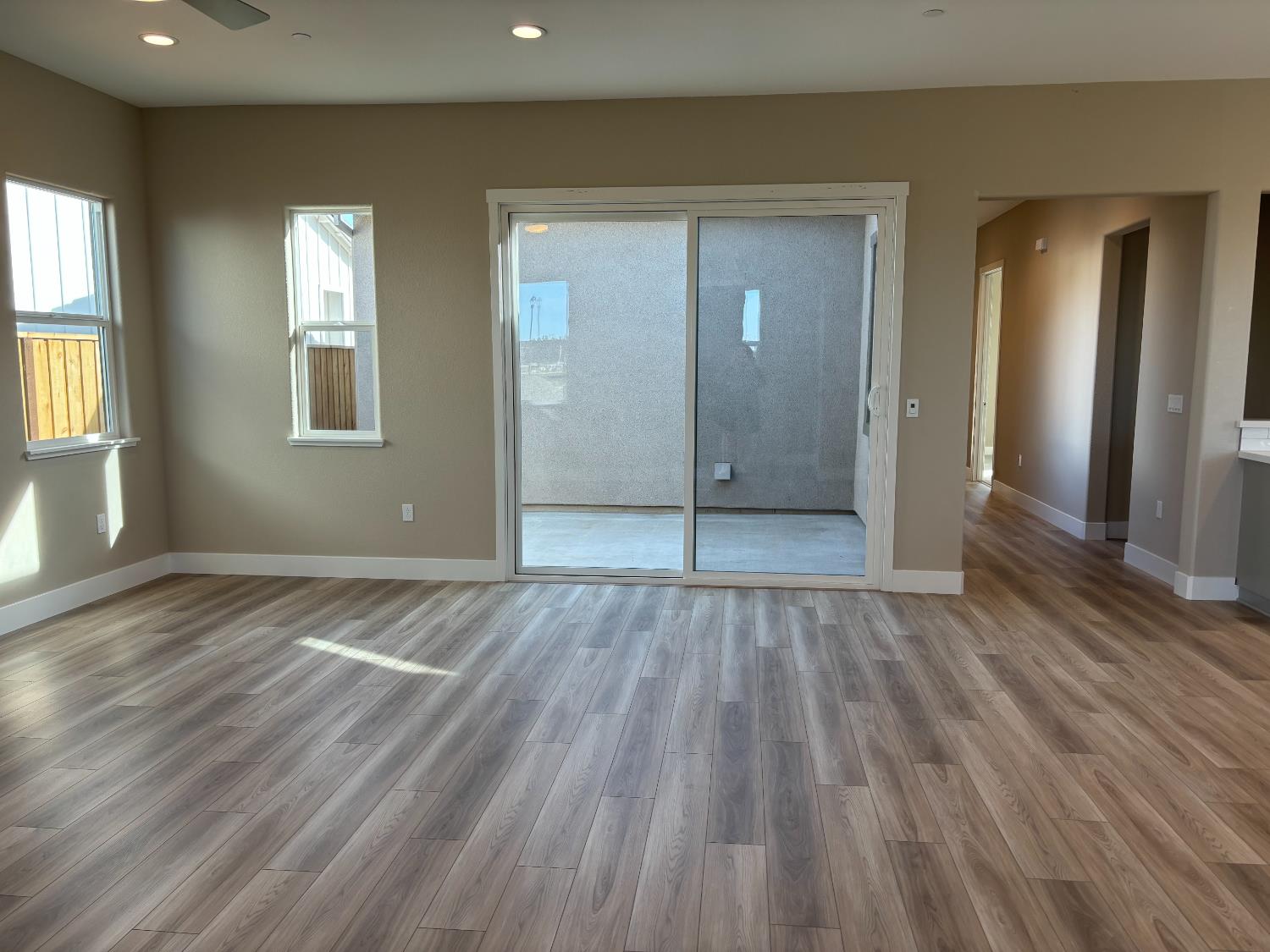 1815 Foster Lane Davis, CA 95616 - Photo 3 of 44 an empty room with wooden floor and windows