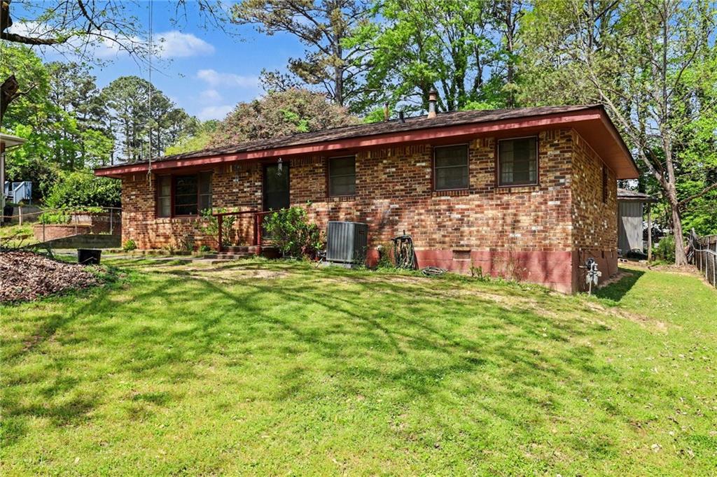 7019 Lake View Lane Doraville, GA 30360 - Photo 2 of 32 a backyard of a house with barbeque oven