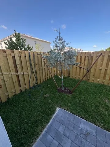 a view of a pathway with a garden