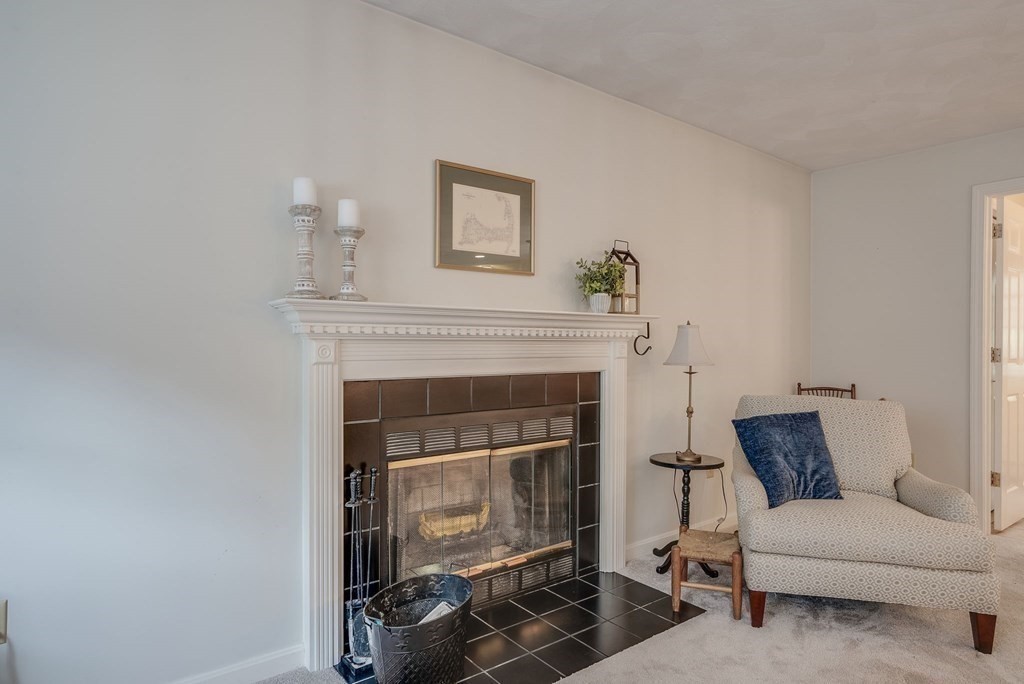 4 Carbone Circle Maynard, MA 01754 - Photo 13 of 38 a living room with furniture and a fireplace