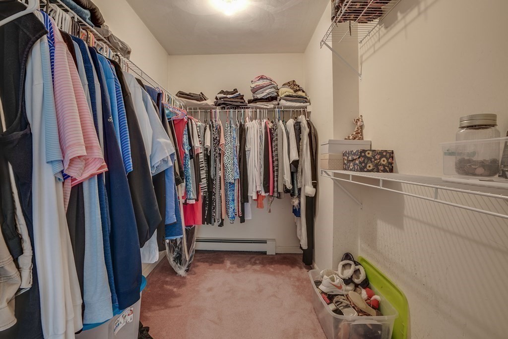 4 Carbone Circle Maynard, MA 01754 - Photo 18 of 38 a view of walk in closet with clothes and shoes