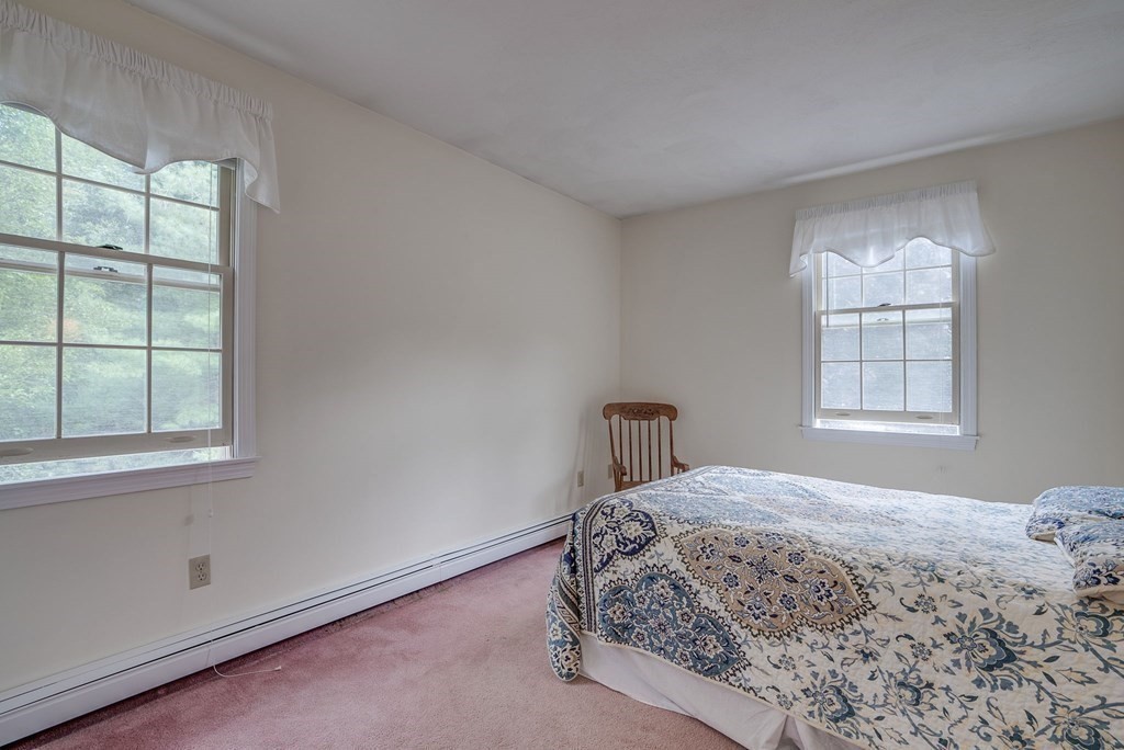 4 Carbone Circle Maynard, MA 01754 - Photo 20 of 38 a bedroom with a bed and a window
