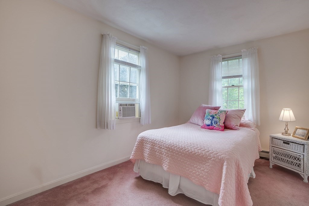 4 Carbone Circle Maynard, MA 01754 - Photo 23 of 38 a bedroom with a bed and a window