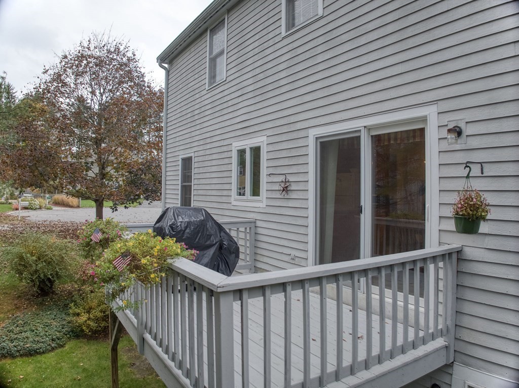 4 Carbone Circle Maynard, MA 01754 - Photo 27 of 38 a view of a house with backyard and trees