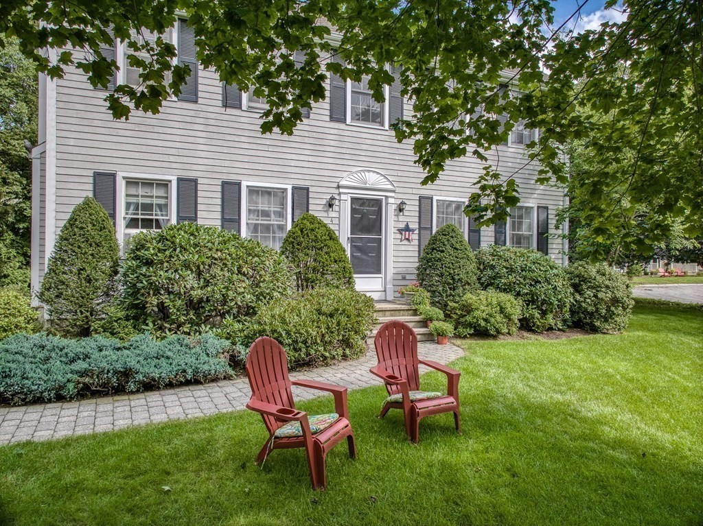 4 Carbone Circle Maynard, MA 01754 - Photo 30 of 38 a view of a chair and table in back yard of the house