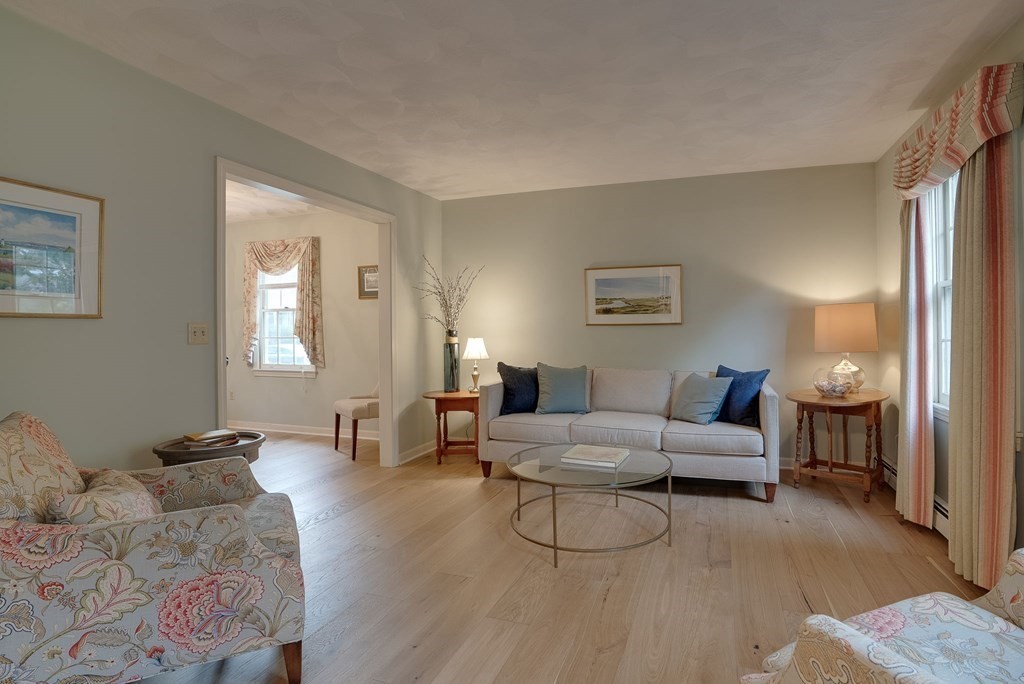 4 Carbone Circle Maynard, MA 01754 - Photo 3 of 38 a living room with furniture and wooden floor
