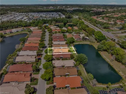 an aerial view of residential houses with outdoor space