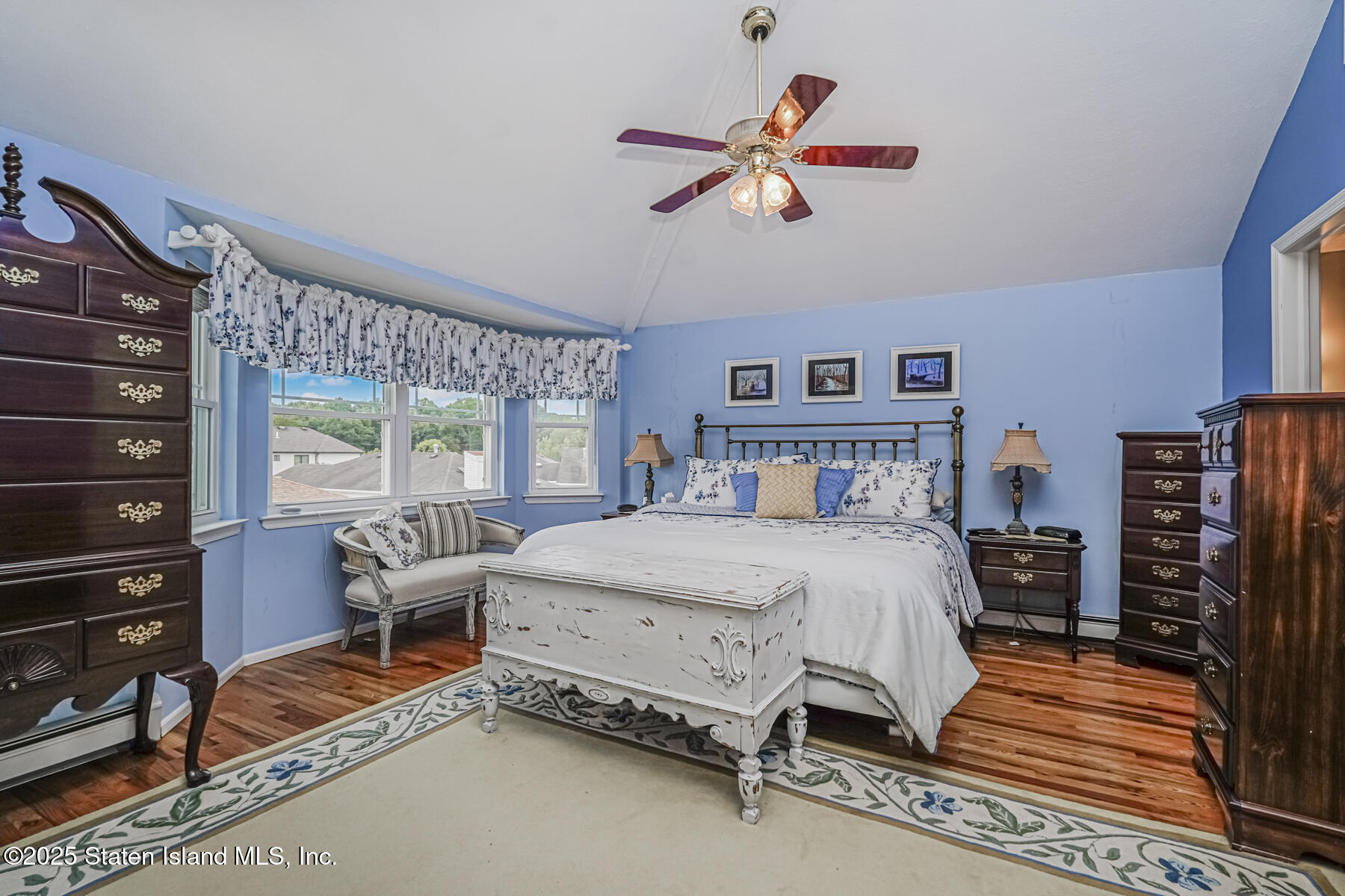 31 Savo Loop Staten Island, NY 10309 - Photo 18 of 41 a bedroom with a bed and wooden floor