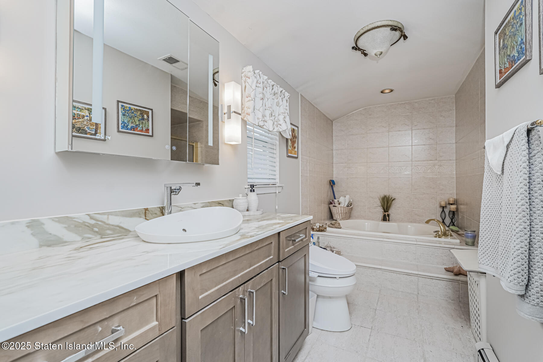 31 Savo Loop Staten Island, NY 10309 - Photo 25 of 41 a spacious bathroom with a granite countertop sink a toilet and a mirror
