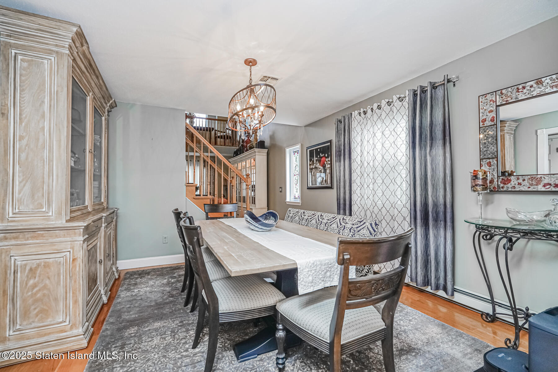 31 Savo Loop Staten Island, NY 10309 - Photo 8 of 41 a view of a dining room with furniture window and wooden floor