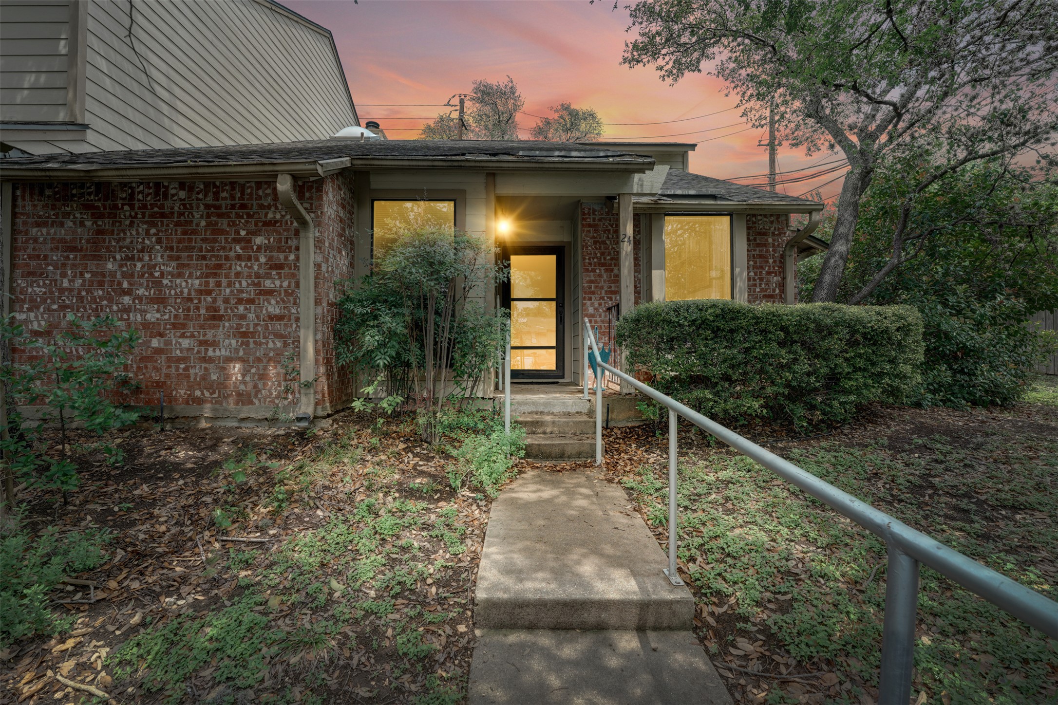 3801 Menchaca Road, Unit 24 Austin, TX 78704 - Photo 1 of 25 a front view of a house with garden