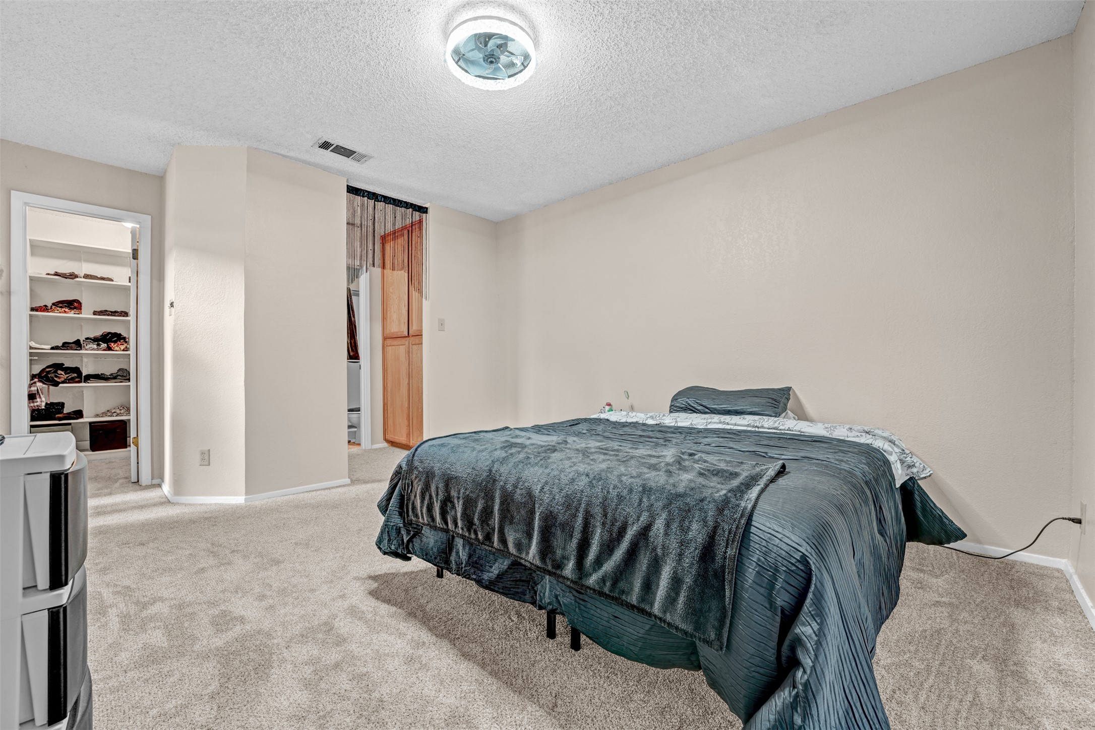 3801 Menchaca Road, Unit 24 Austin, TX 78704 - Photo 12 of 25 a bedroom with a bed and closet