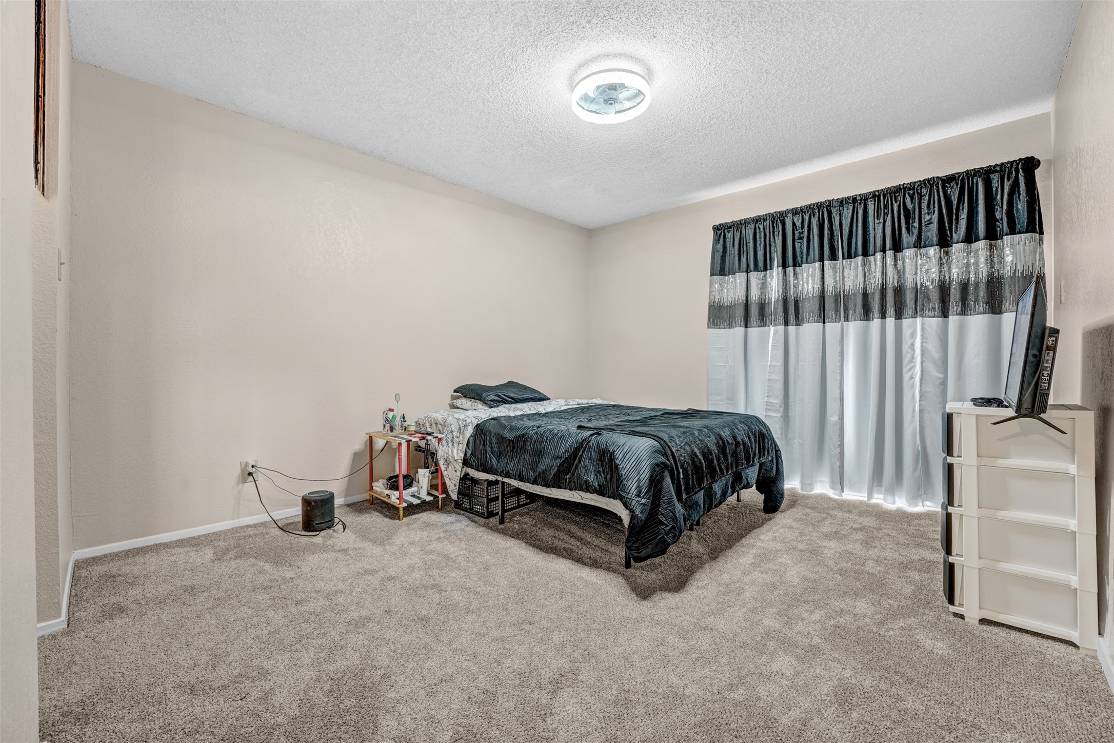 3801 Menchaca Road, Unit 24 Austin, TX 78704 - Photo 15 of 25 a bedroom with a bed and a window