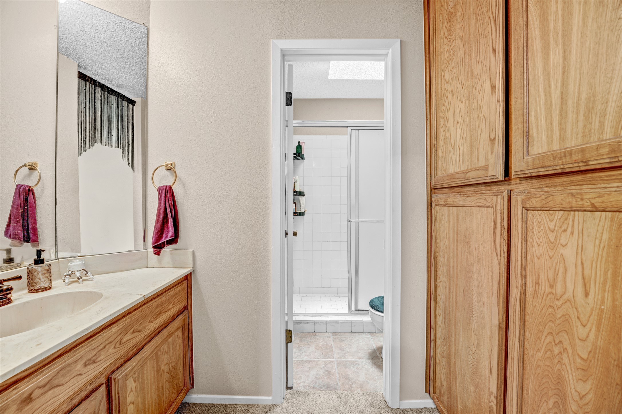 3801 Menchaca Road, Unit 24 Austin, TX 78704 - Photo 16 of 25 a bathroom with a double vanity sink and a mirror