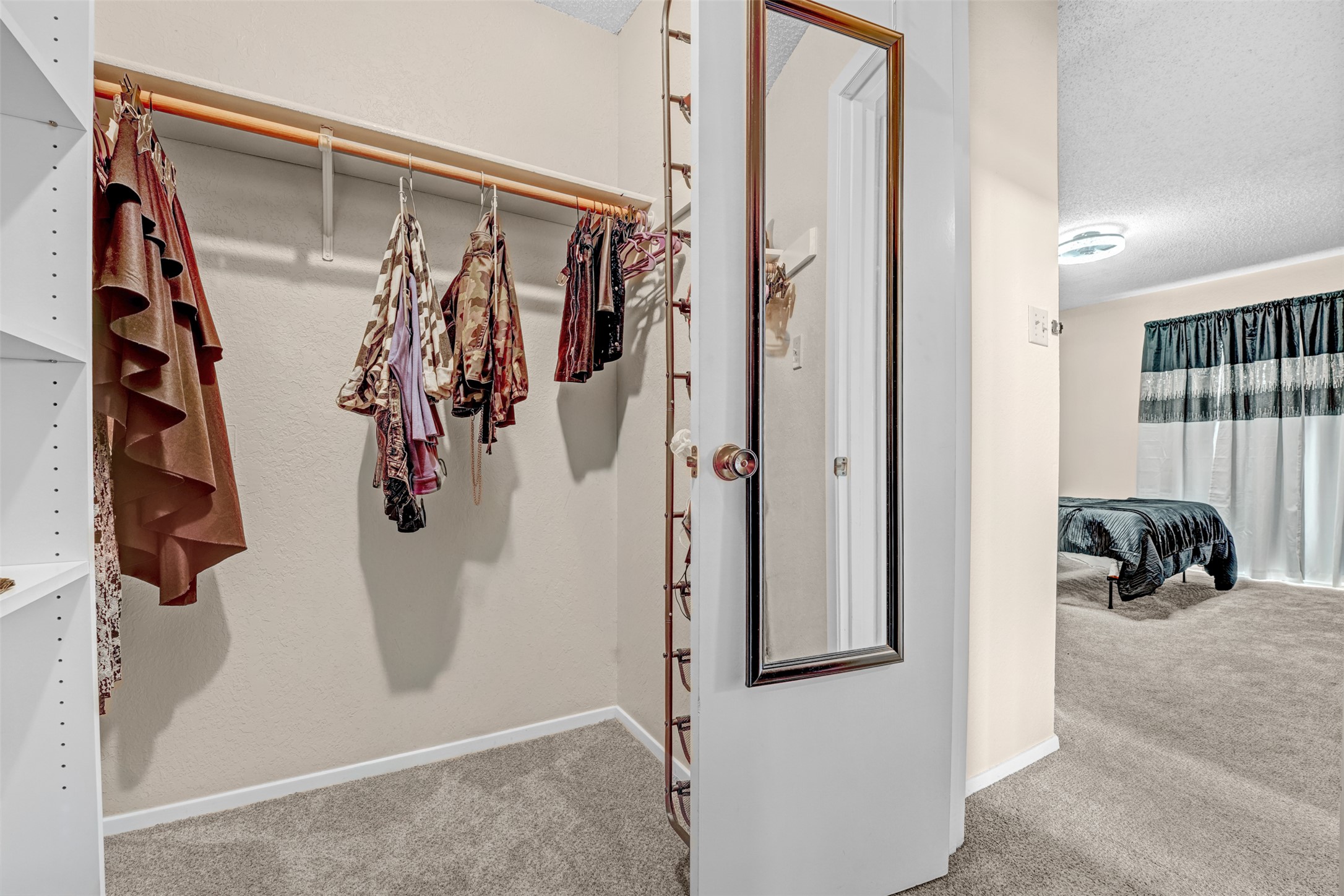 3801 Menchaca Road, Unit 24 Austin, TX 78704 - Photo 20 of 25 a view of walk in closet with clothes and shoes