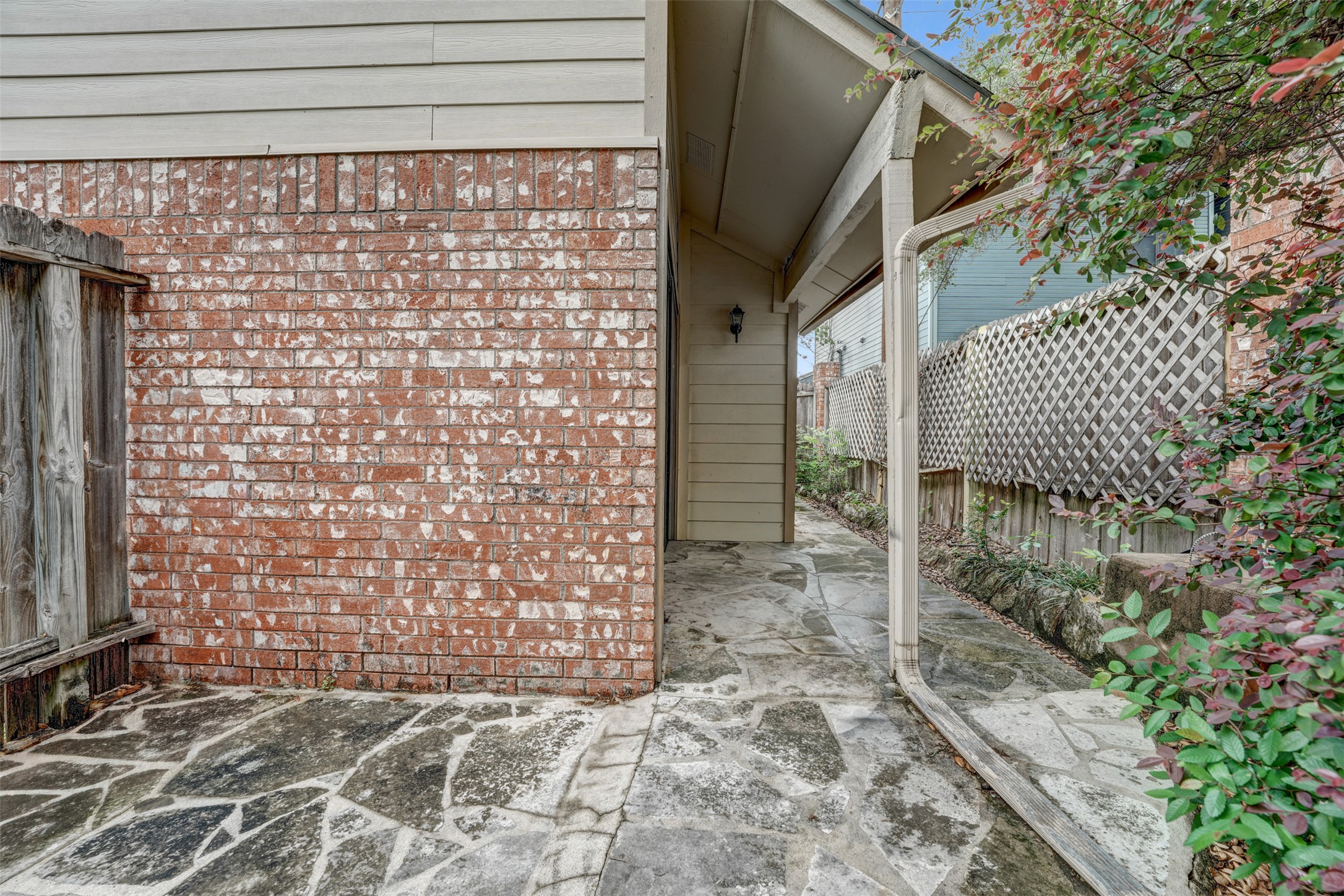 3801 Menchaca Road, Unit 24 Austin, TX 78704 - Photo 23 of 25 a view of a brick house with an outdoor space
