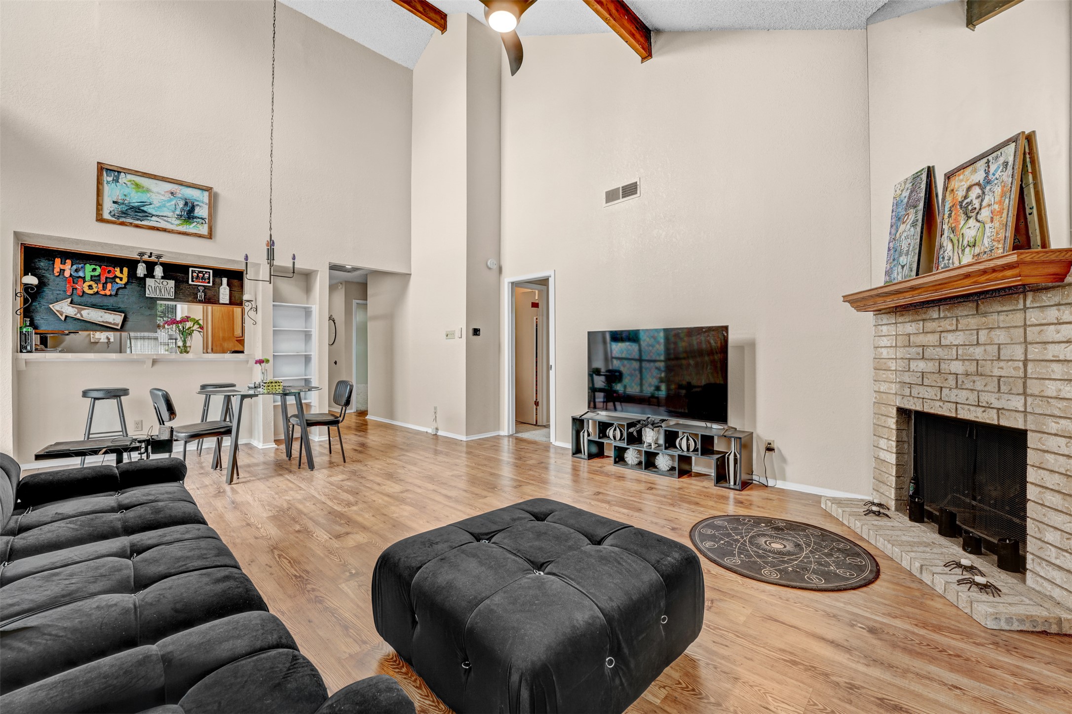 3801 Menchaca Road, Unit 24 Austin, TX 78704 - Photo 8 of 25 a living room with furniture a flat screen tv and a fireplace