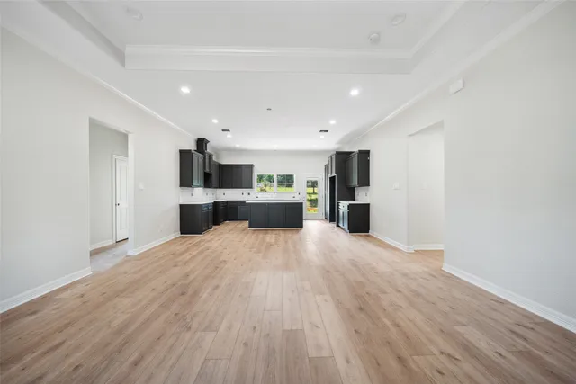 a view of a kitchen with a sink and a refrigerator
