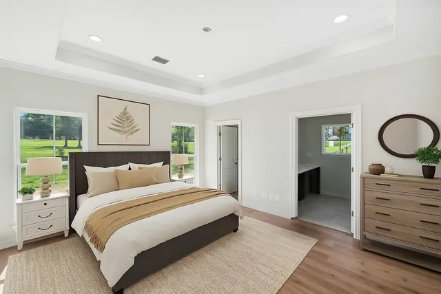 a bedroom with a bed and a dresser