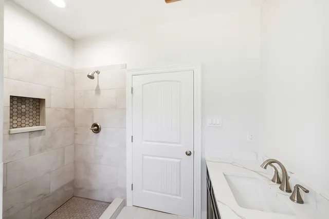 a bathroom with a sink and shower