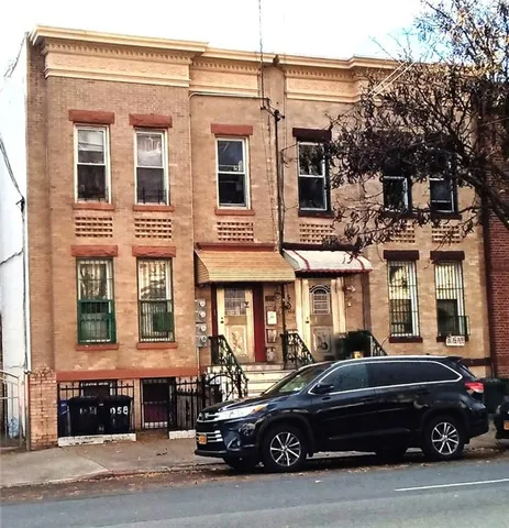 a view of a car parked in front of a building