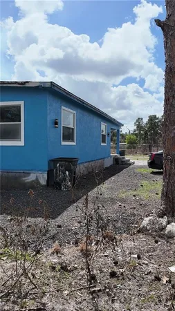 a backyard of a house with lots of green space