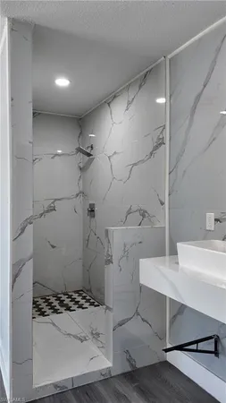 a bathroom with a sink and a mirror