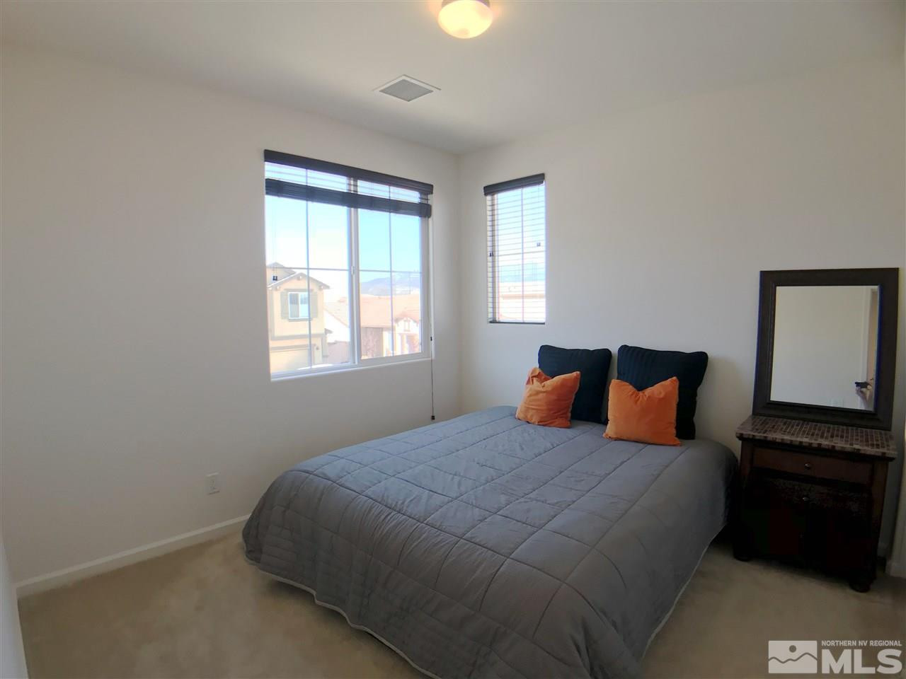 2935 Show Jumper Lane Reno, NV 89521 - Photo 13 of 19 a bedroom with a bed and a window