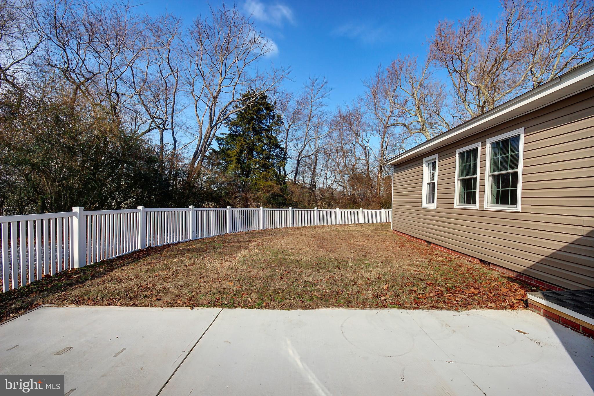 26177 Rewastico Road Hebron, MD 21830 - Photo 3 of 20 a view of a backyard of the house