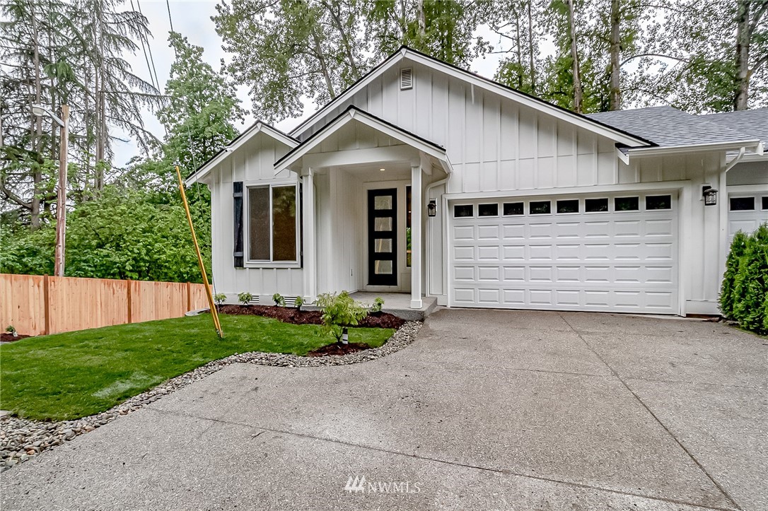 2624 Callow Road, Unit A Lake Stevens, WA 98258 - Photo 1 of 22 a front view of a house with a yard and garage